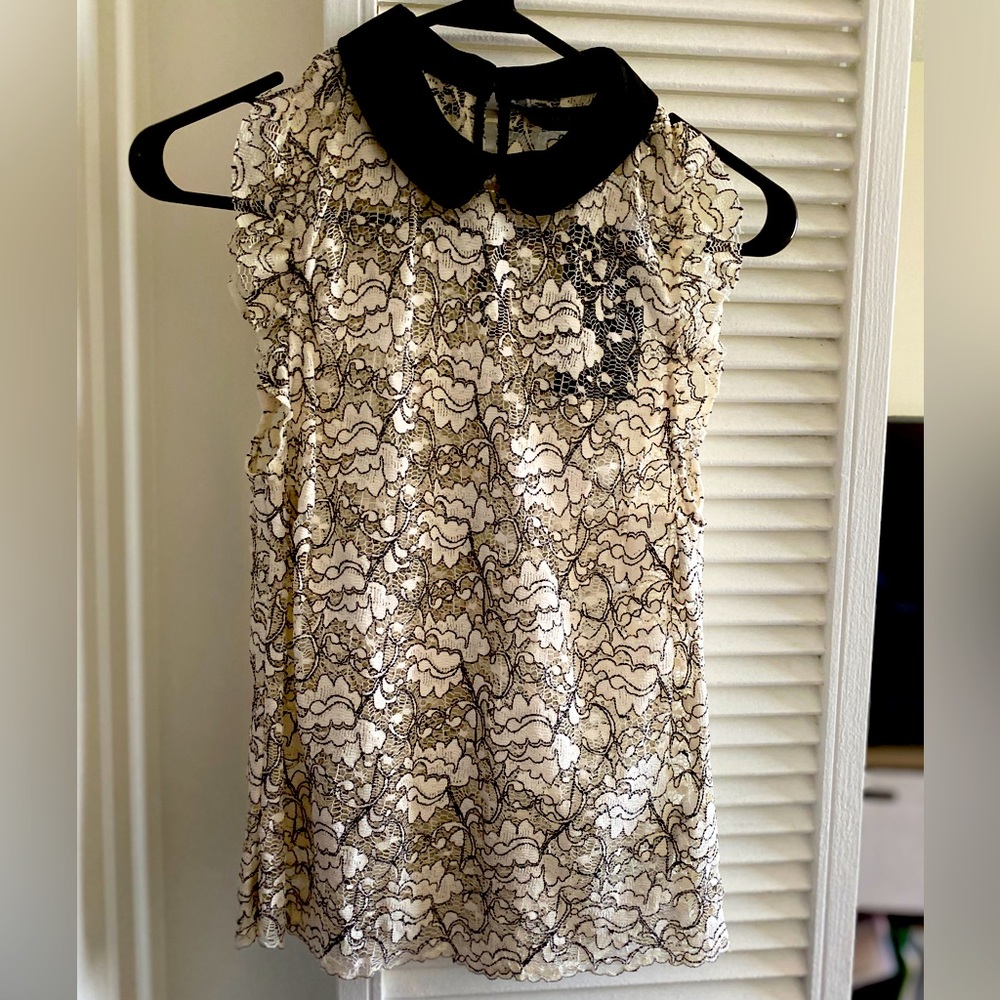 Lacey white top with black collar